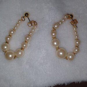 Avon marked faux pearl pushback dangle earrings.